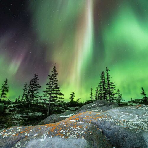 Churchill, Manitoba, 2021. Lighting the foreground with a simple flashlight can give us both greater foreground interest and a greater sense of visual depth. Using a wider focal length, in this case 16mm, helps too, but only if you can see that foreground.