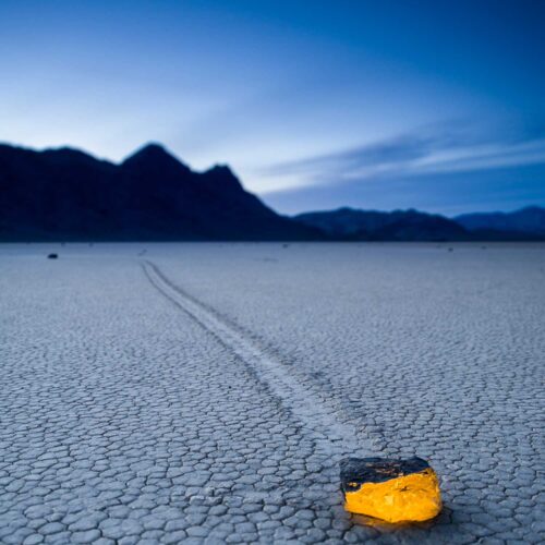 Death Valley, 2011. This sailing rock at the Racetrack Playa was lit with a flashlight and a CTO gel. The color contrast between the warm rock and the cool background creates greater visual depth than the images I made without it. Nikon D3S at 24mm. Exposure: 1 second, f/4.5, ISO 200.