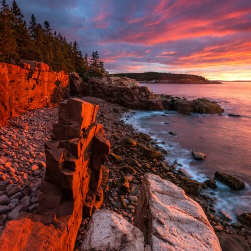 A granite column formed over 15,000 years of receding glaciers rests on the beach after being knocked over by a massive wave during a 2024 storm.