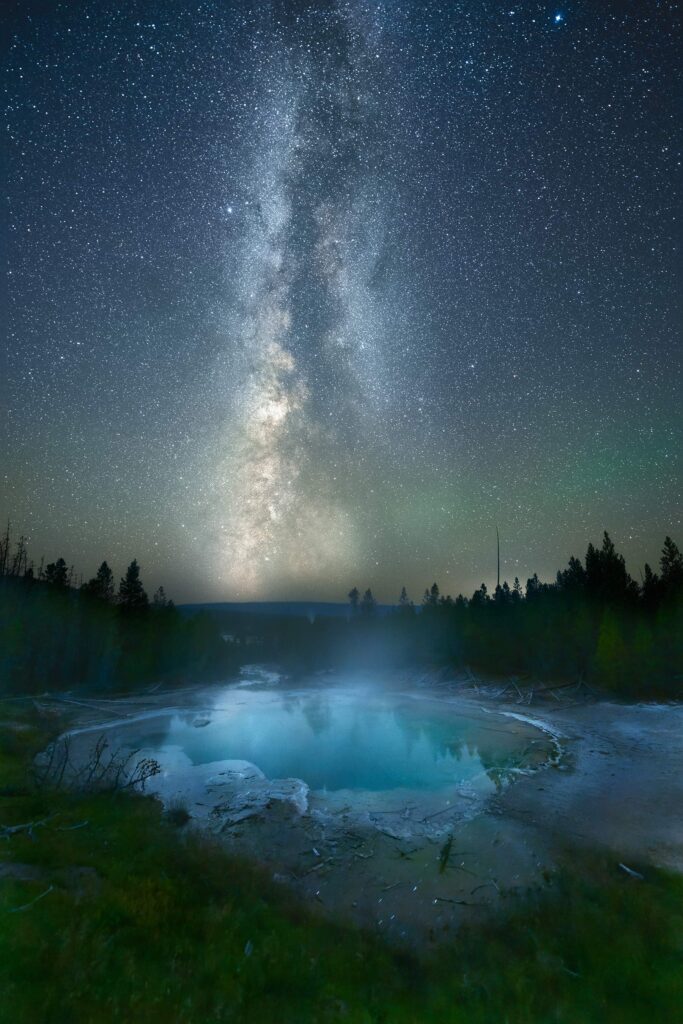 Yellowstone National Park, Wyoming The autumn Milky Way and stars reflect in the still waters of Emerald Spring in the back basin of Norris Geyser Basin.