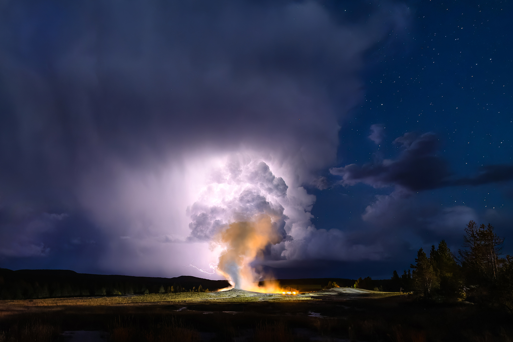 Yellowstone National Park, Wyoming A summer storm fills the sky with lightning, illuminating the skies above the iconic Old Faithful Geyser in the Upper Geyser Basin.