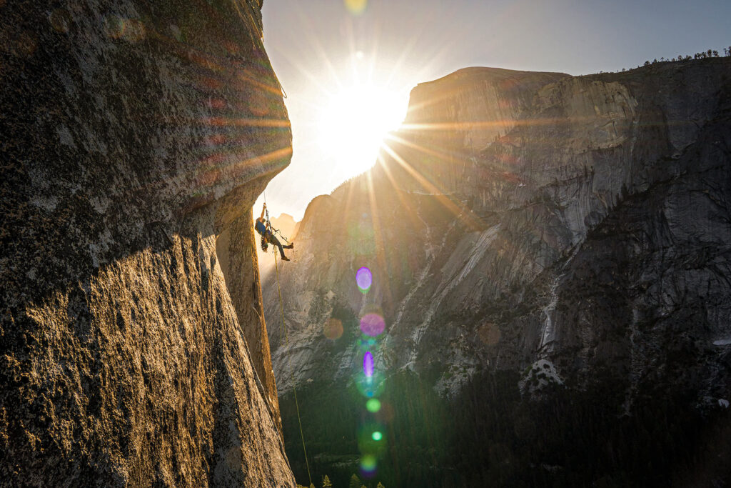 photo of action shot of Nick Smith rock climbing
