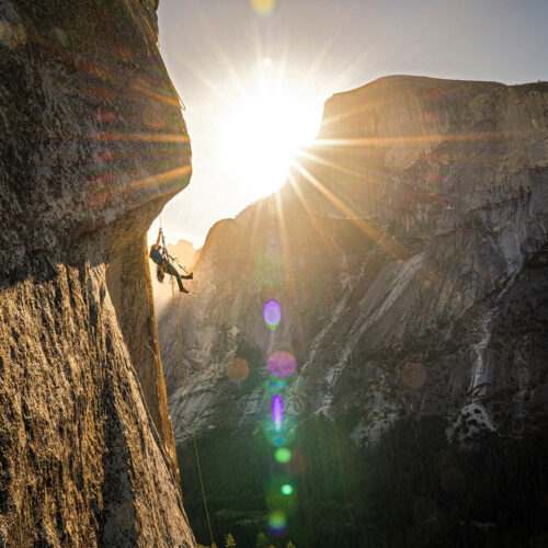 photo of action shot of Nick Smith rock climbing