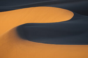 Photo of Wind-molded Ibex Dunes displaying classic s-shaped forms.